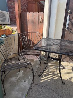 Wrought Iron Patio Table and 2 Chairs/ 30.00