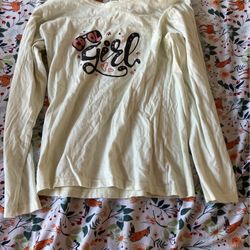 Light Yellow Long Sleeve Shirt With Pink And Black Star And Writting Saying “Cool Girl” In A Very Designed Way