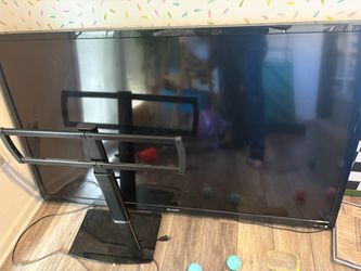 70 inch sharp aquos tv with universal stand.