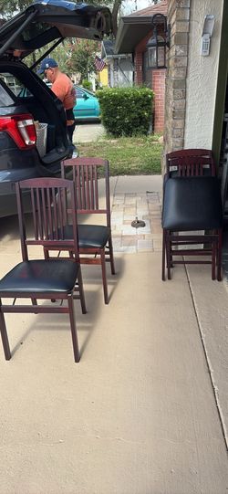 Set of 4 Cosco brand solid wood folding chairs