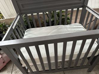 mini crib with mattress
