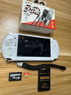 White PSP 3000 with 100 games installed.         M83
