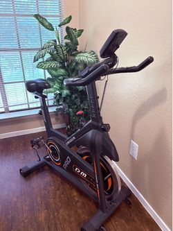 a DMASUN Magnetic Resistance Indoor Cycling Bike
