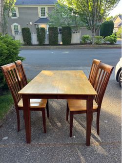 Wooden table and four chairs