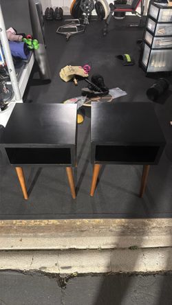 Set of two black and walnut side tables