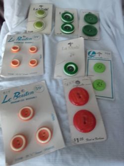 Vintage sewing items, buttons, ribbons, pin cushions