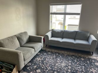 Grey living spaces love seat and sofa