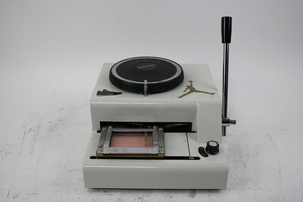 Credit card embossing machine