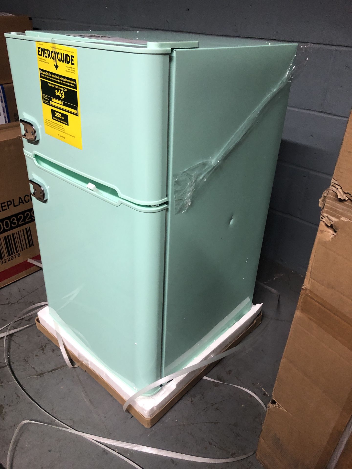 Compact Mini Refrigerator with Separate Freezer in the box with small dent on one side
