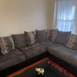 Ashley  Sectional 2 Piece Suede Grey Sofas With 3 Black Glass Tables And 2 Lamps  an Electric Fire Place Dark Brown 
