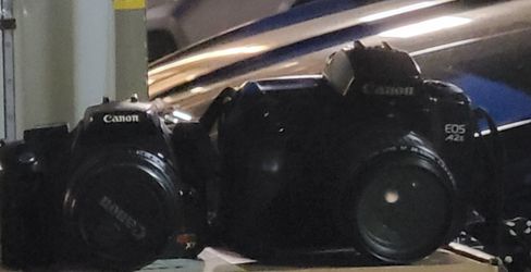 TWO CANON EOS CAMERAS. ONE DIGITAL ONE FILM. CANON 70-300 LENS