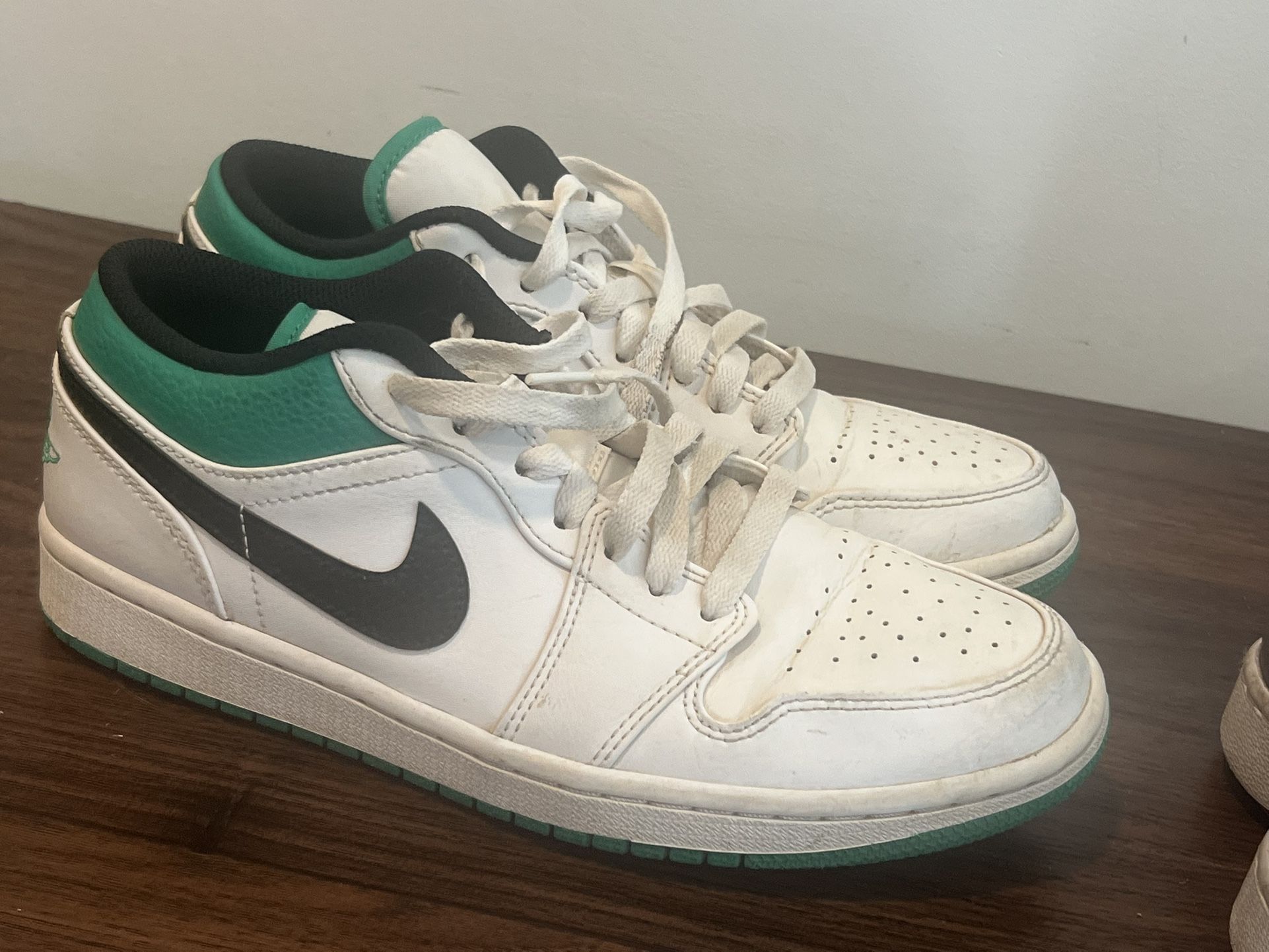 Two Nikes, One Pair Of Vans.