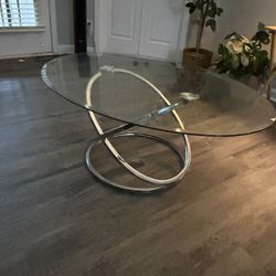 Glass  Coffee Table Silver Bottom $30