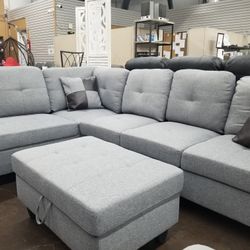 Light Gray Fabric Sectional With A Matching Ottoman