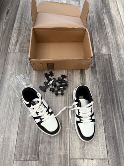 Black and White Low-Top Sneakers with Accessories