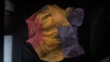 Mnml tie-dye sweater with yellow, red, and blue colors
