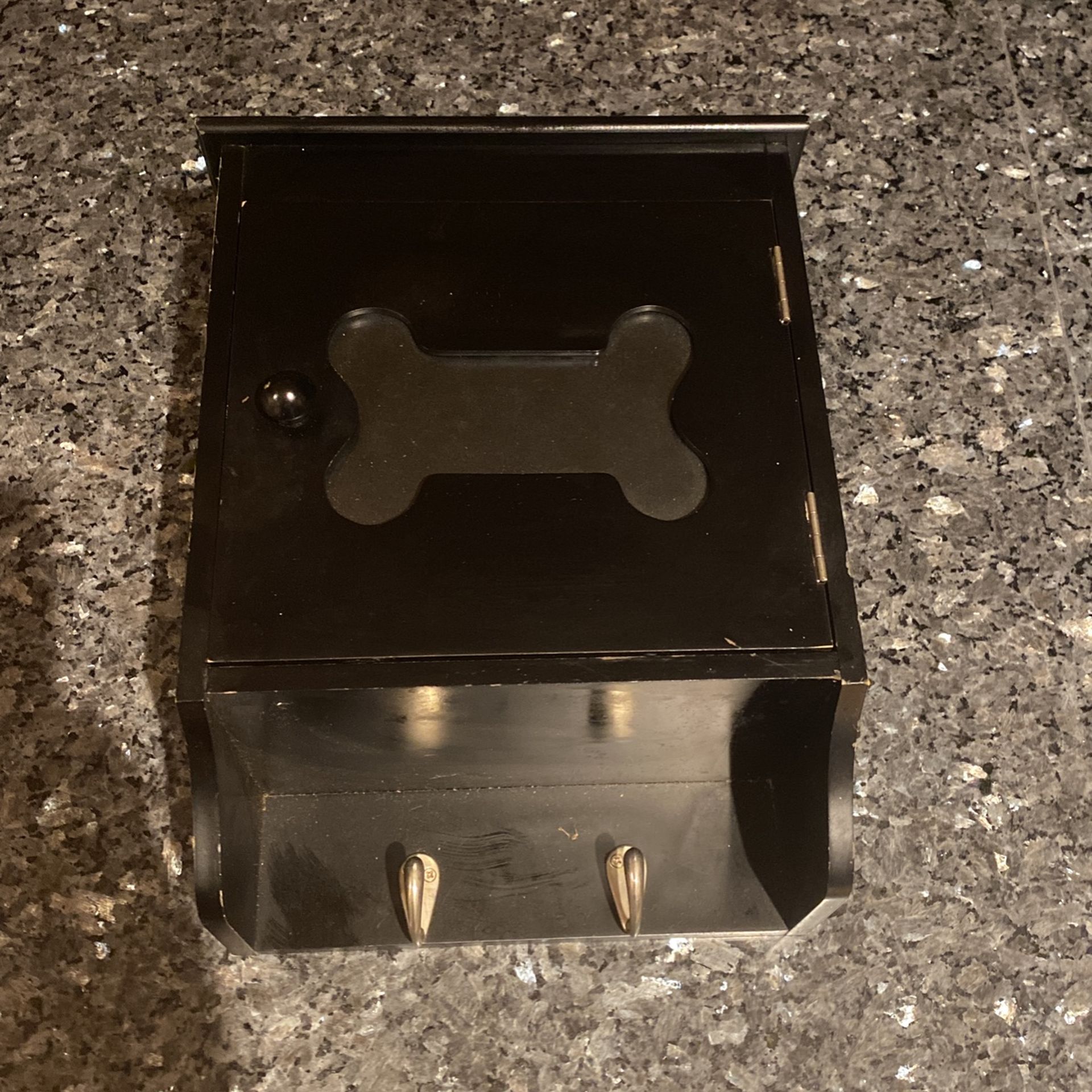 Wooden dog storage box you can put dog treats in it or different items you can put a picture in the front and two hooks to hang a leash collar etc.