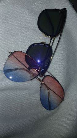 2 pairs of glasses one blue and pink the other is purple shade