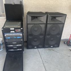 Speakers, Mixing Board, And Controls With Cords And Power Supply. 