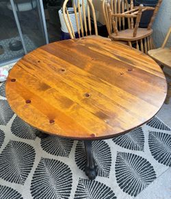 Round solid wood dining table
