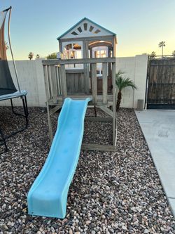 Kidkraft Outdoor wood playhouse with slide