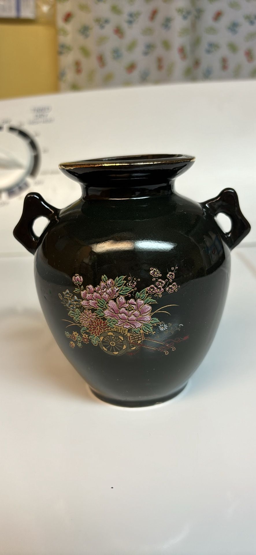Chinese 4.25” black 2 handle vase lavendar pink purple flowers deep red lotus in rickshaw gold trim Original tag on bottom Made in Taiwan