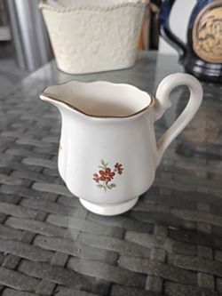 Left white floral pitcher
Small cream pitcher