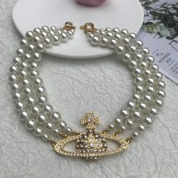 Vivienne Westwood Three Row Pearl Bas Relief Choker in Gold