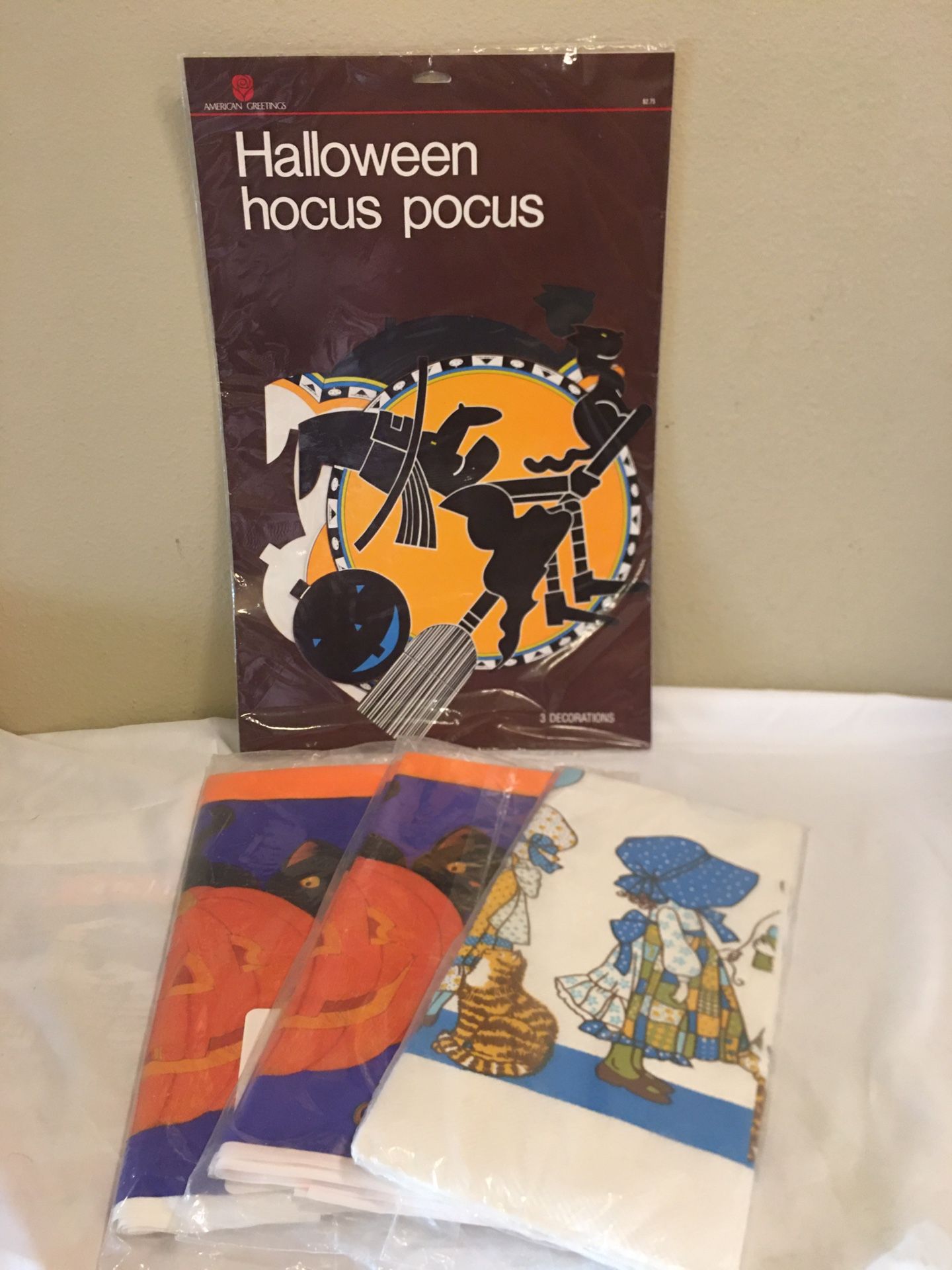 Lot of 3 Holliday table cloths (1- Thanksgiving 54”x 96”)& 2 - (Halloween 54”x96”). 1 Pkg. of 3 Hocus Pocus decorations . All in original packaging ne