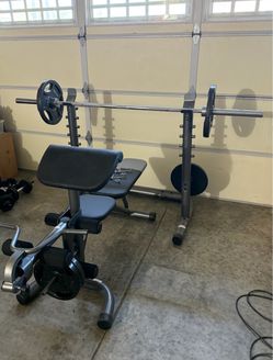 Weight Bench with Barbell and Plates