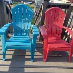 Two Plastic Adirondack Chairs