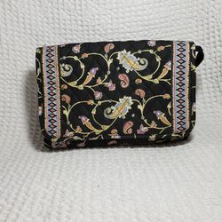 Americana by Sharif travel bag. Bag is a quilted material small change purse inside with a long plastic pocket . Zipper closure.  Outside is also a po