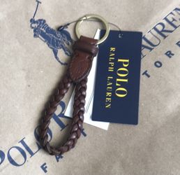 From the design house of Ralph Lauren, Polo presents the dark saddle brown braided leather FOB key chain. Features a brass split "O" ring to secure
