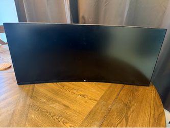 LG 34” Curved Monitor with Adjustable wall mount.