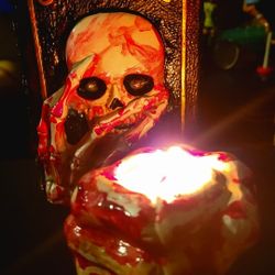 Halloween Props, Horror Bloody: pre-owned, as is. (2) items. Book of Spells (5"×8") (battery operated) flashing eyes & hand Skellington candle holder,