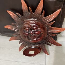 Wall Deco piece featuring a sun design with a holder for candles / $7