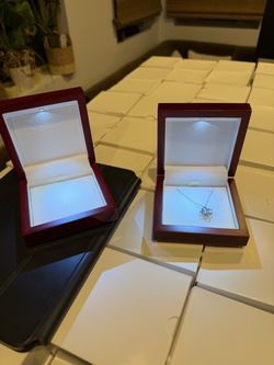 Jewlery boxes, some with necklaces