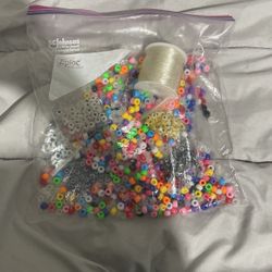 Bag of pony beads, evil eyes, and bracelet string.