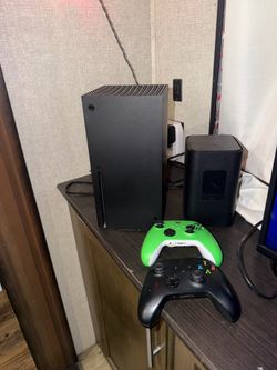 Xbox Series X with two controllers