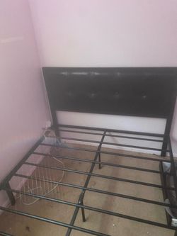 Full size black metal and faux leather bed frame
