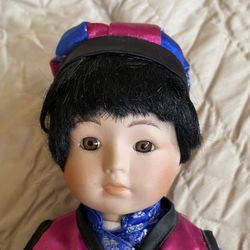 VINTAGE porcelain doll with accompanying hat, shoes.