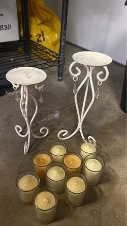 2 iron candle holders and new candles