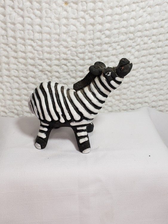 Zebra figurine with a different look 4 1/2" X 4 1/2" . Good condition and smoke free home. 