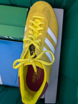 Yellow and white Adidas