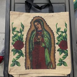 Virgin of Guadalupe Sturdy Jute Shopping Tote Bag," typically featuring a full-color printed design on eco-friendly, natural burlap material with fabr