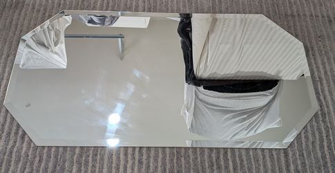 Frameless Octagonal Wall Mirror With Beveled Edges.