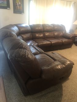 Brown like new sectional very comfy with pull out bed inside couch