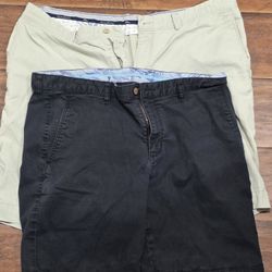 Great Tommy Bahama shorts, two pairs. Tan pair is size 38, made with 52% cotton, 45% Tencel, 3% spandex. Black pair is size 36. Both have a comfy fit.