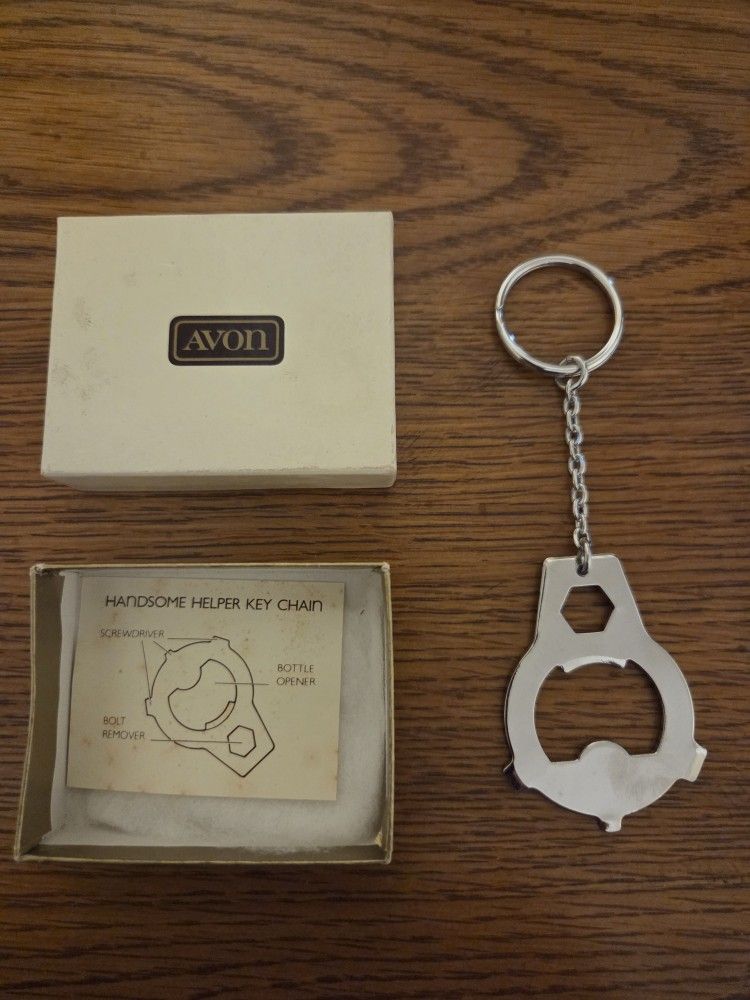 Avon key chain with Screwdriver, bottle opener, and bolt remover