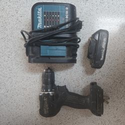 Makita Set.  Battery Charger And Drill. 